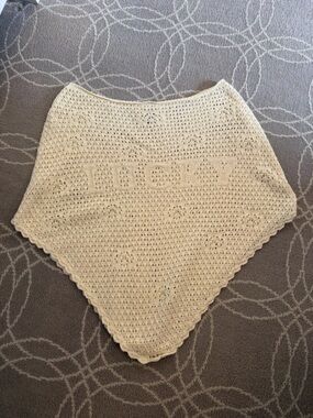 Frankie’s Bikinis x Bella Hadid crochet cream Lucky poncho top